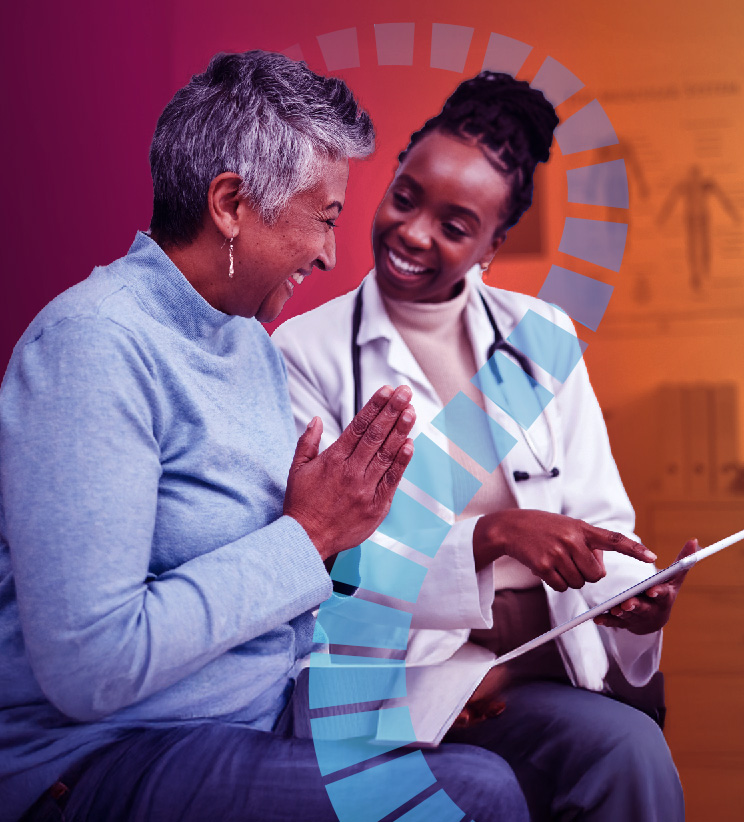 In a medical office, a smiling Black female doctor in a white coat with a stethoscope points at a tablet while an older woman with short gray hair in a light blue sweater looks on joyfully, hands clasped in appreciation; a semi-transparent blue segmented circular graphic overlays the warm orange background with a blurred anatomy chart and filing cabinets.